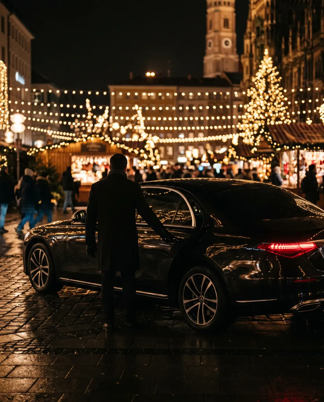 Chauffeur opening the sedan door at the Munich Christmas market
